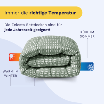 Gefaltetes Zelesta Wonderbed - Olive Stitches Mikrofaser Bettdecke mit weißen Mustern, antiallergisch und für alle Jahreszeiten geeignet-wärmt im Winter, kühlt im Sommer. Deutscher Text hebt die optimale Temperaturregulierung hervor.